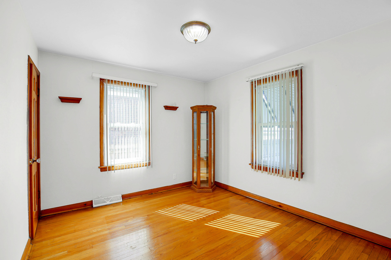 10922 South Ave B Chicago, IL 60617 - Photo 9 of 24 a view of an empty room with a window