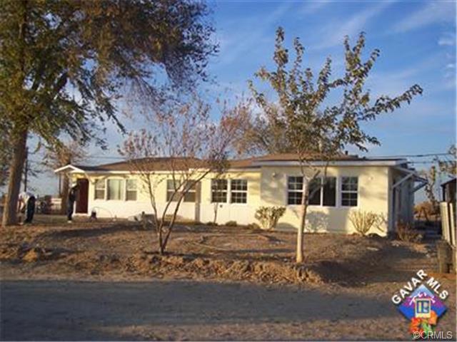 44727 Graphic Street Lancaster, CA 93535 - Photo 2 of 5 front view of a house with a tree