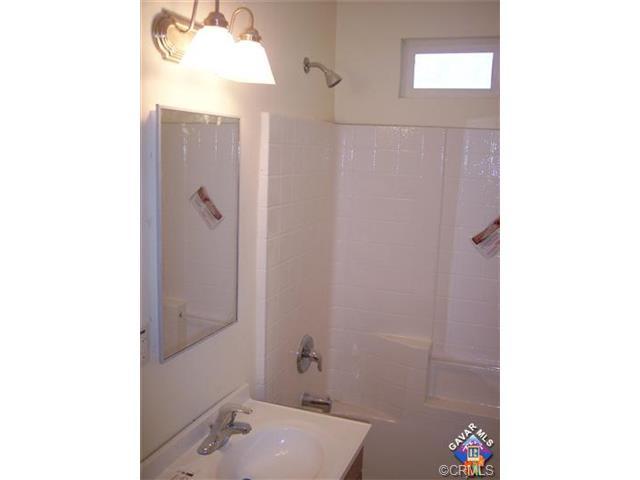 44727 Graphic Street Lancaster, CA 93535 - Photo 5 of 5 a bathroom with a sink and a mirror