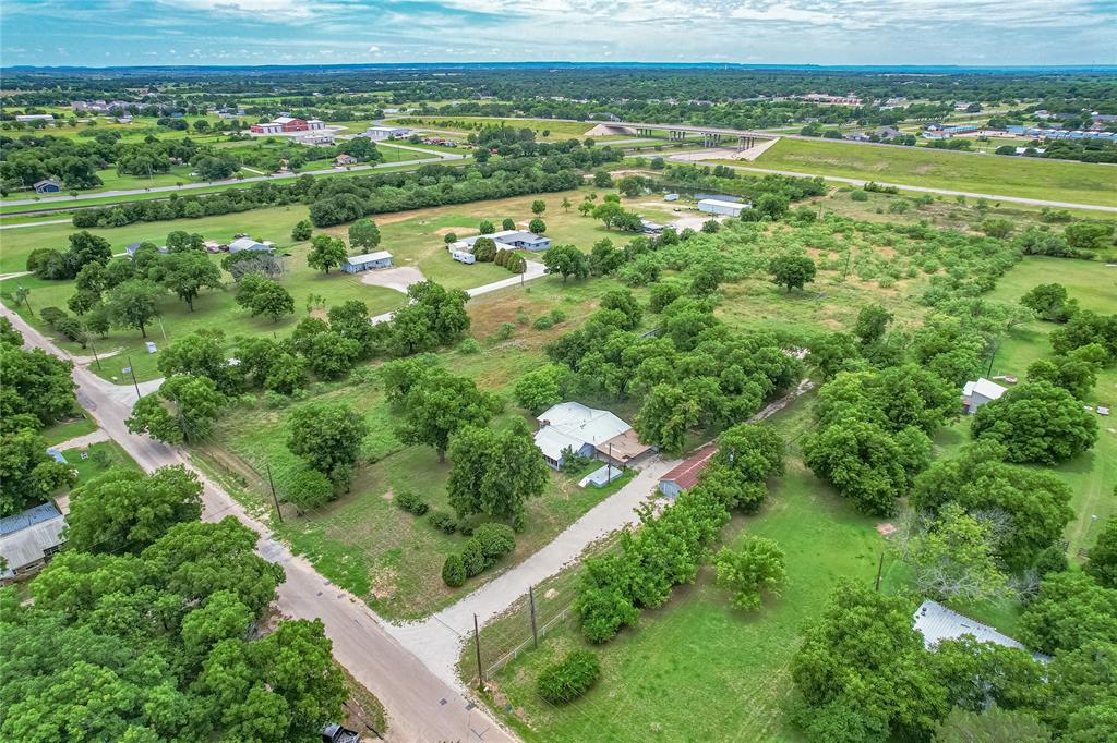 510 Hamby Road Clyde, TX 79510 - Photo 4 of 34 Expansive land parcel featuring multiple structures amidst mature trees and open green spaces