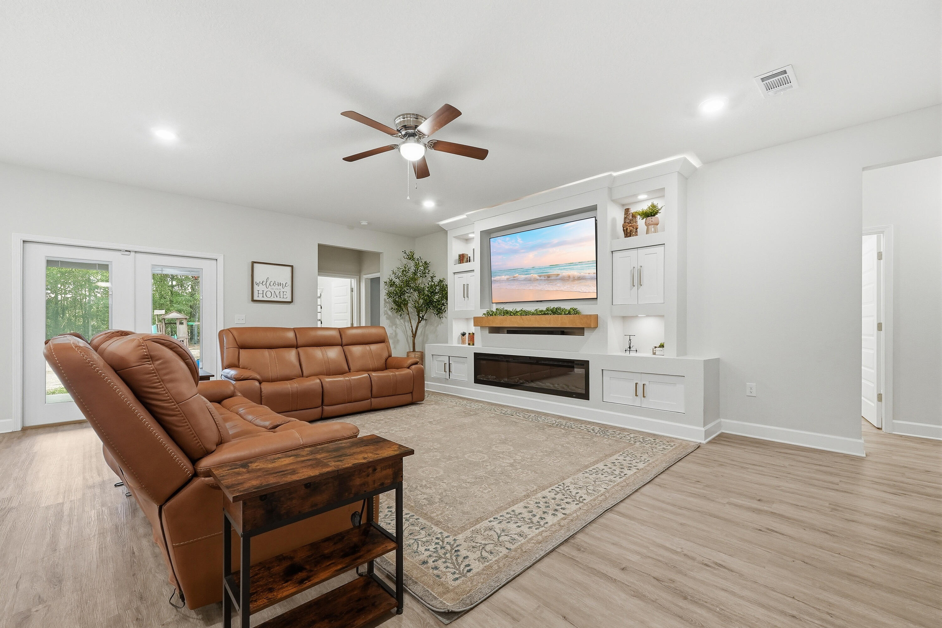 5833 La Porte Road Crestview, FL 32539 - Photo 13 of 44 a living room with furniture and a flat screen tv