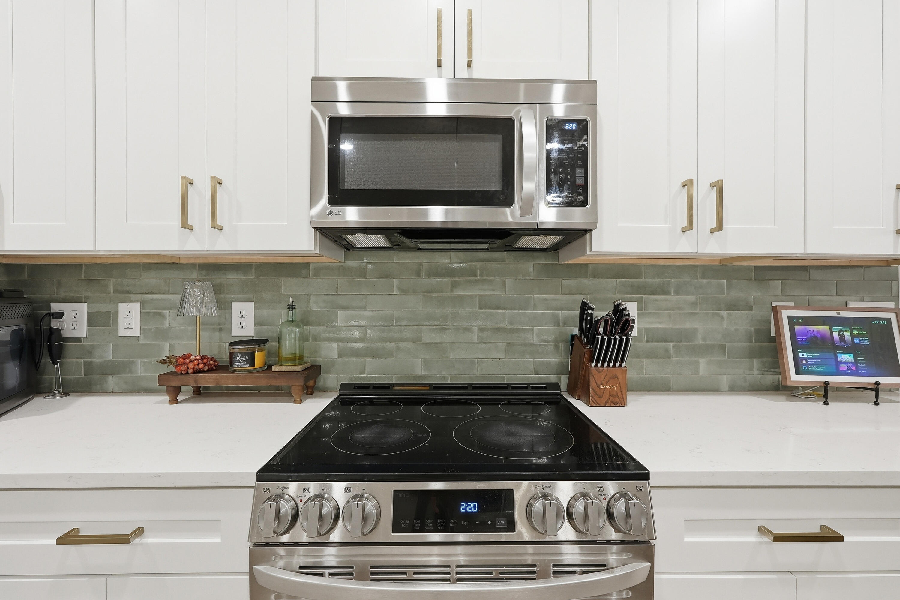 5833 La Porte Road Crestview, FL 32539 - Photo 18 of 44 a kitchen with stainless steel appliances granite countertop a stove and a microwave