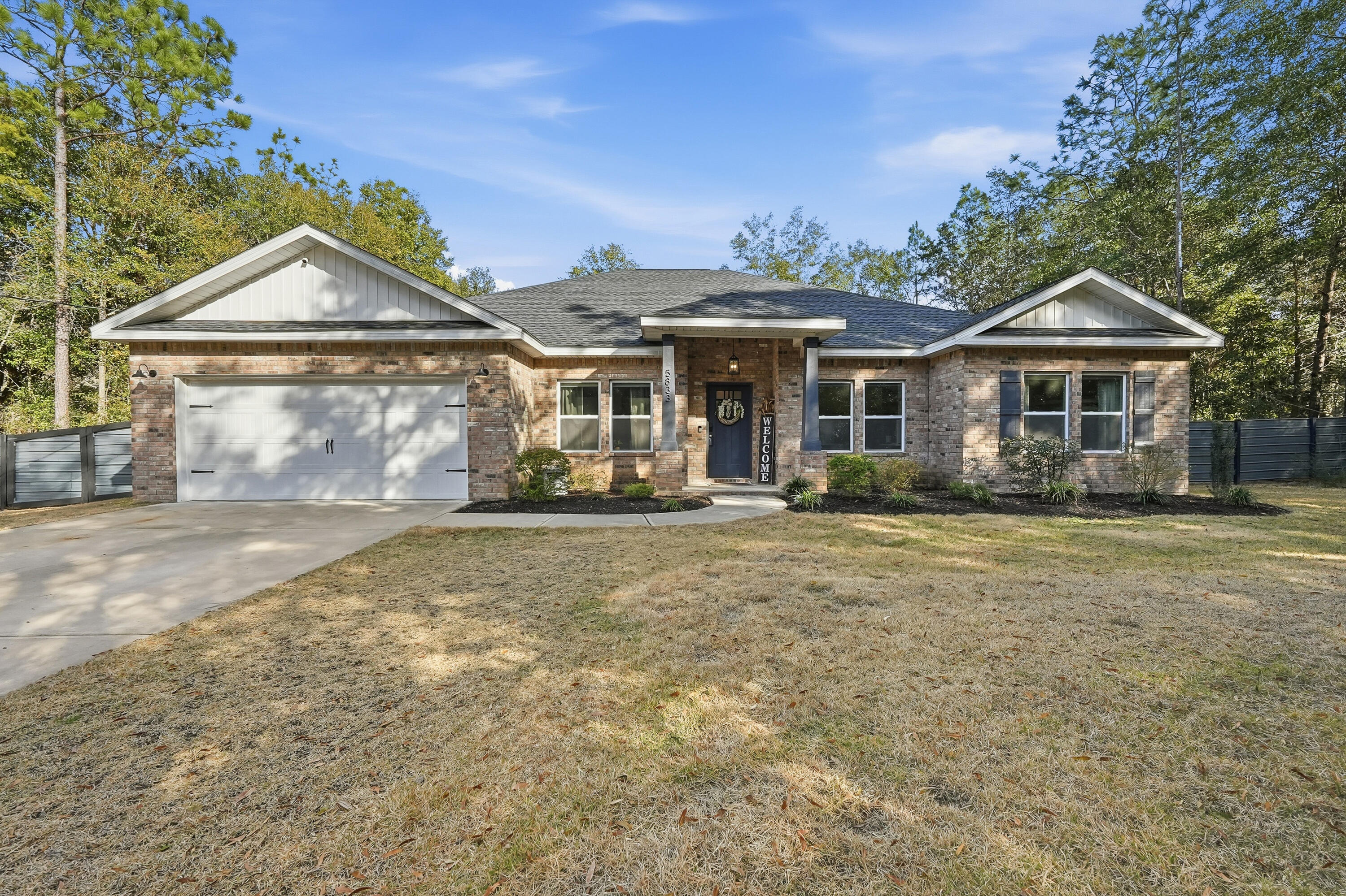 5833 La Porte Road Crestview, FL 32539 - Photo 2 of 44 a front view of a house with garden