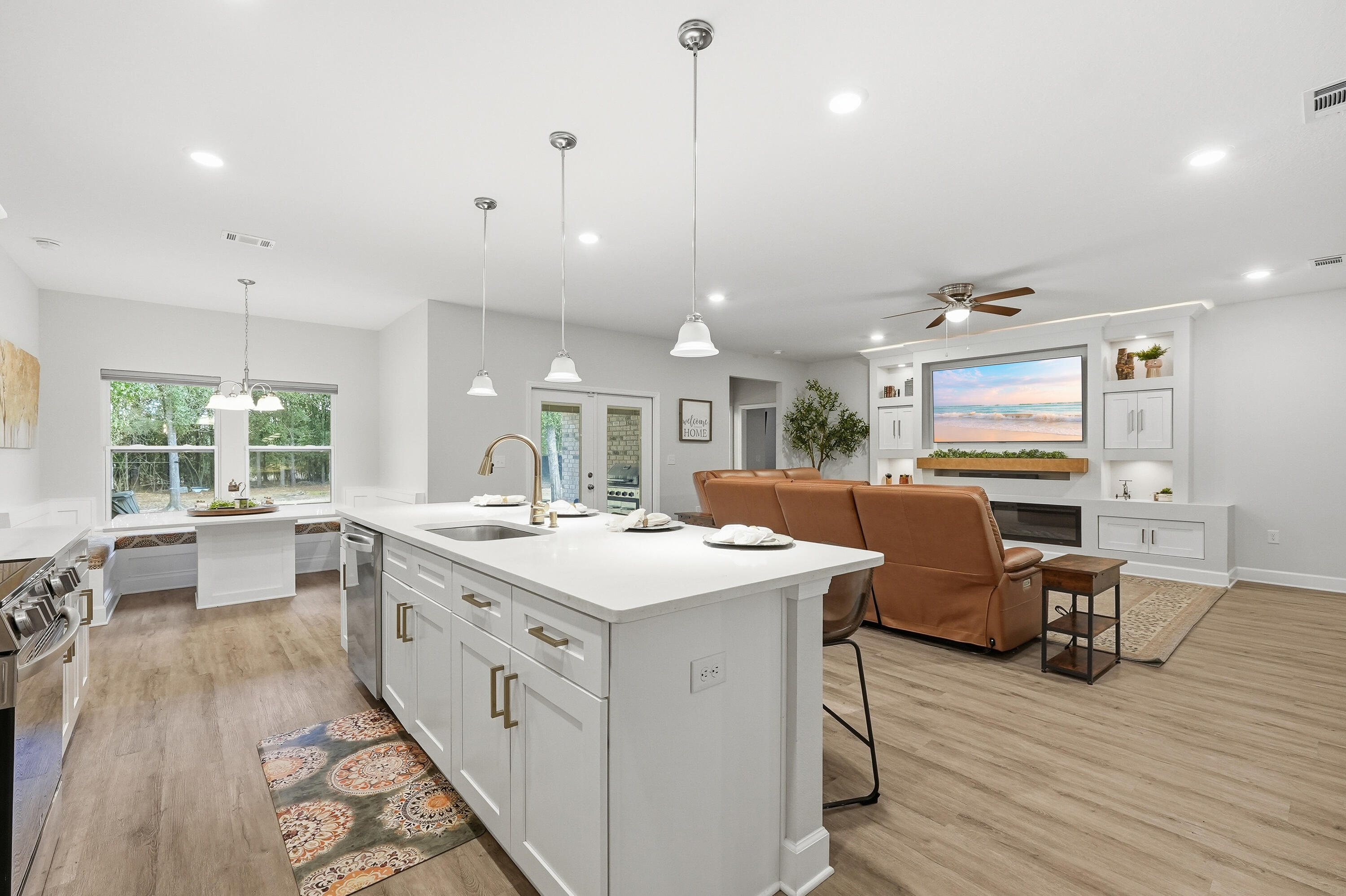 5833 La Porte Road Crestview, FL 32539 - Photo 21 of 44 an open kitchen with a sink and wooden floor