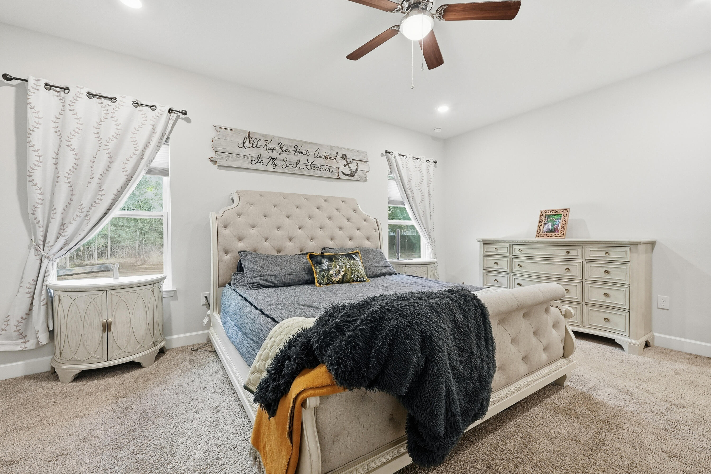 5833 La Porte Road Crestview, FL 32539 - Photo 25 of 44 a bedroom with a bed and a chandelier