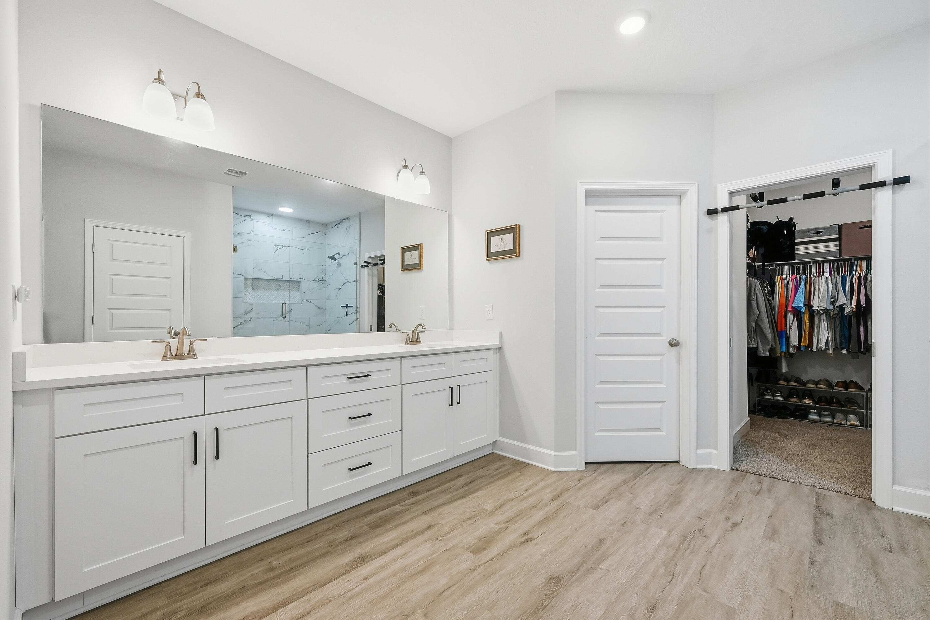 5833 La Porte Road Crestview, FL 32539 - Photo 26 of 44 a spacious bathroom with a granite countertop sink and a mirror