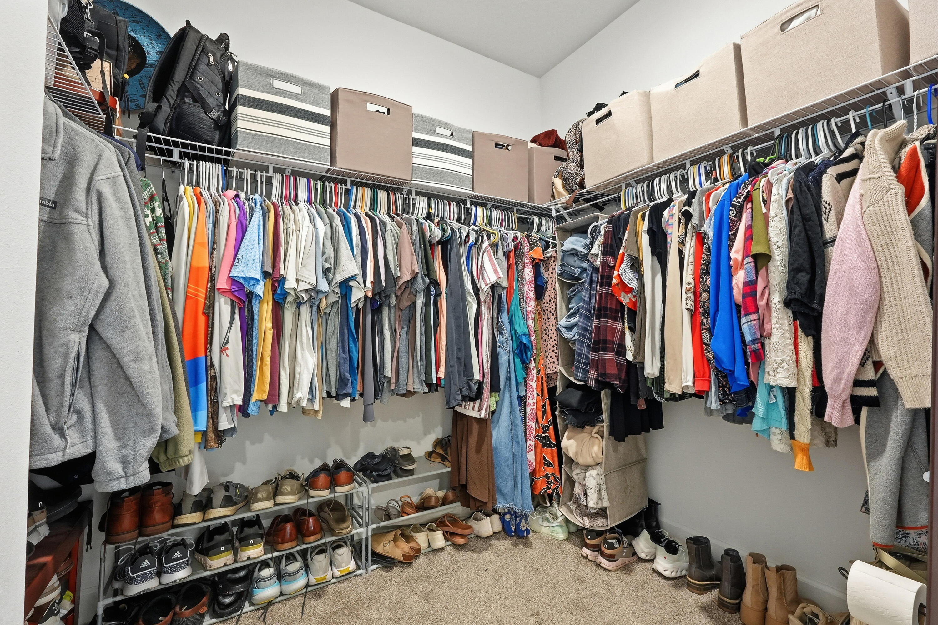 5833 La Porte Road Crestview, FL 32539 - Photo 31 of 44 a view of walk in closet with clothes and shoes