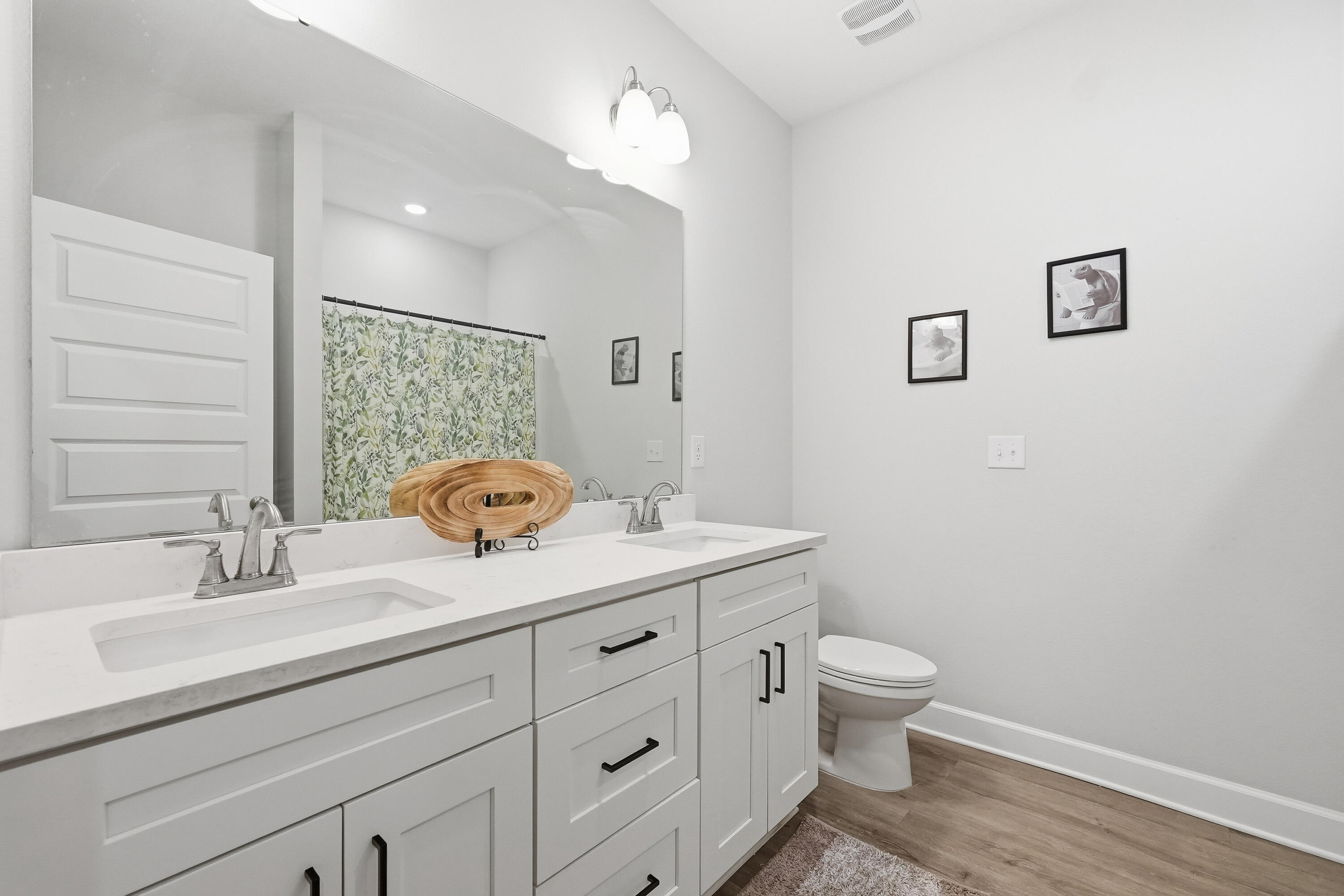 5833 La Porte Road Crestview, FL 32539 - Photo 36 of 44 a bathroom with a toilet a sink and mirror