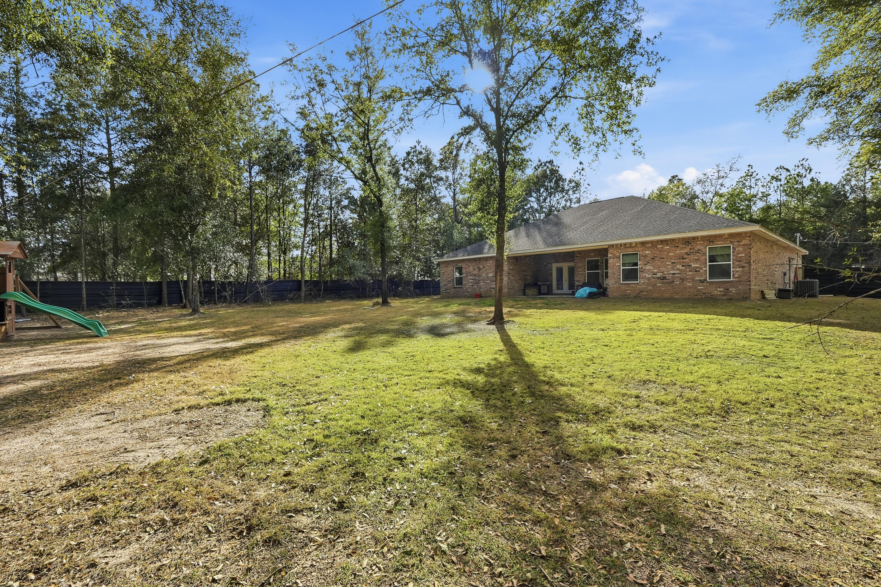 5833 La Porte Road Crestview, FL 32539 - Photo 41 of 44 a view of a house with a yard