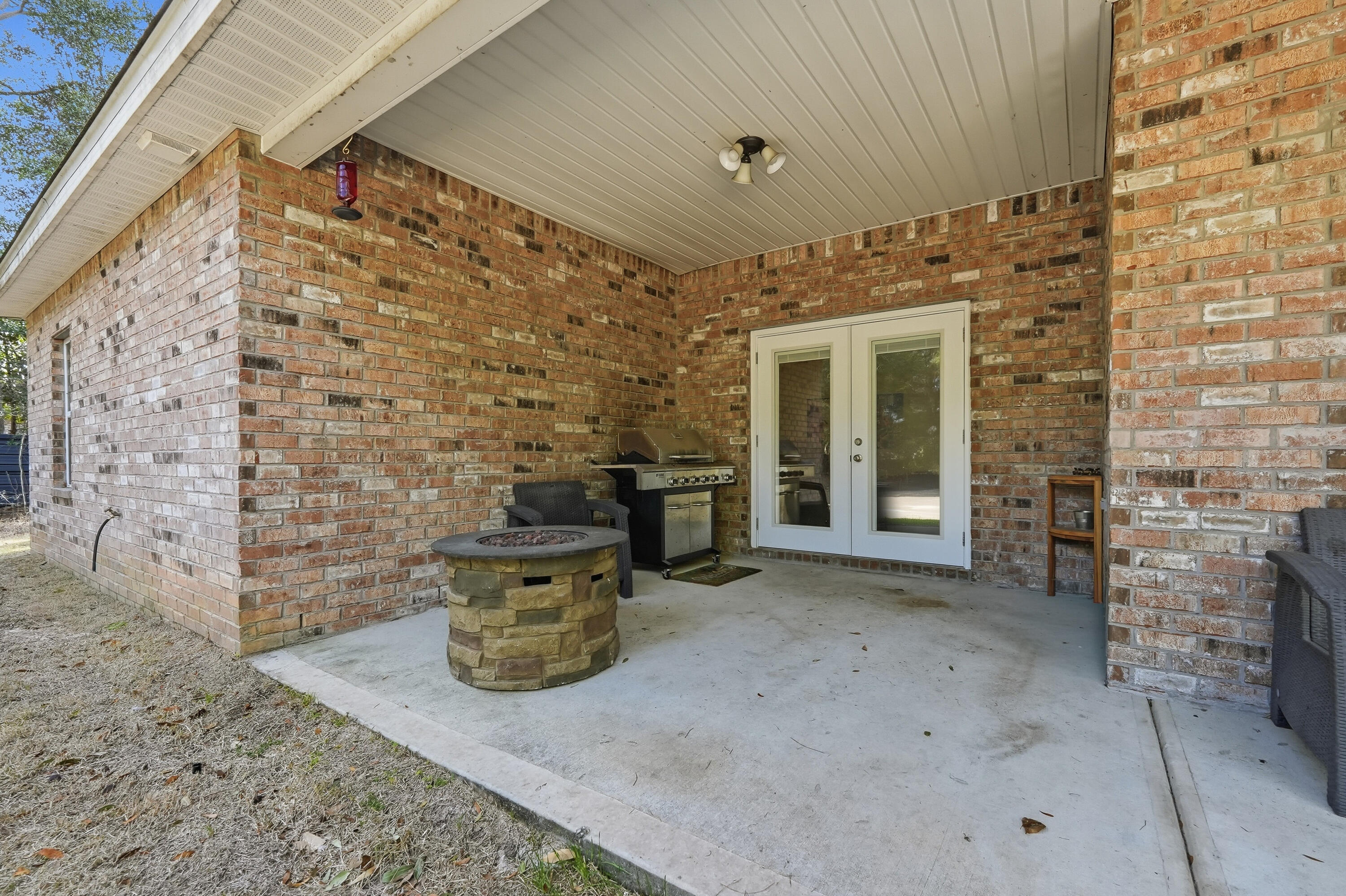 5833 La Porte Road Crestview, FL 32539 - Photo 42 of 44 a view of a door and chair in the patio