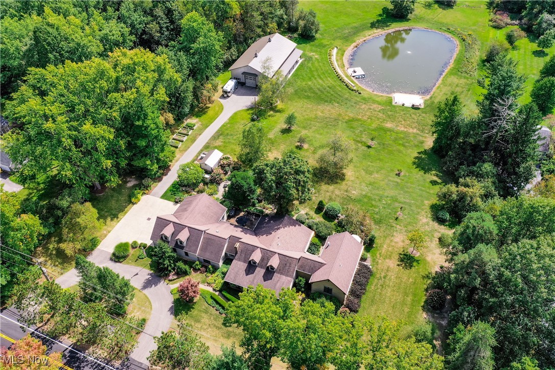 8405 Dines Road Novelty, OH 44072 - Photo 2 of 45 Aerial view of 4.5 acre property with 72' x 42' Morton outbuilding with radiant heat, 2 horse stalls and a washing bay, and a man-made stocked lake with aerator, sand beach and row boat dock.