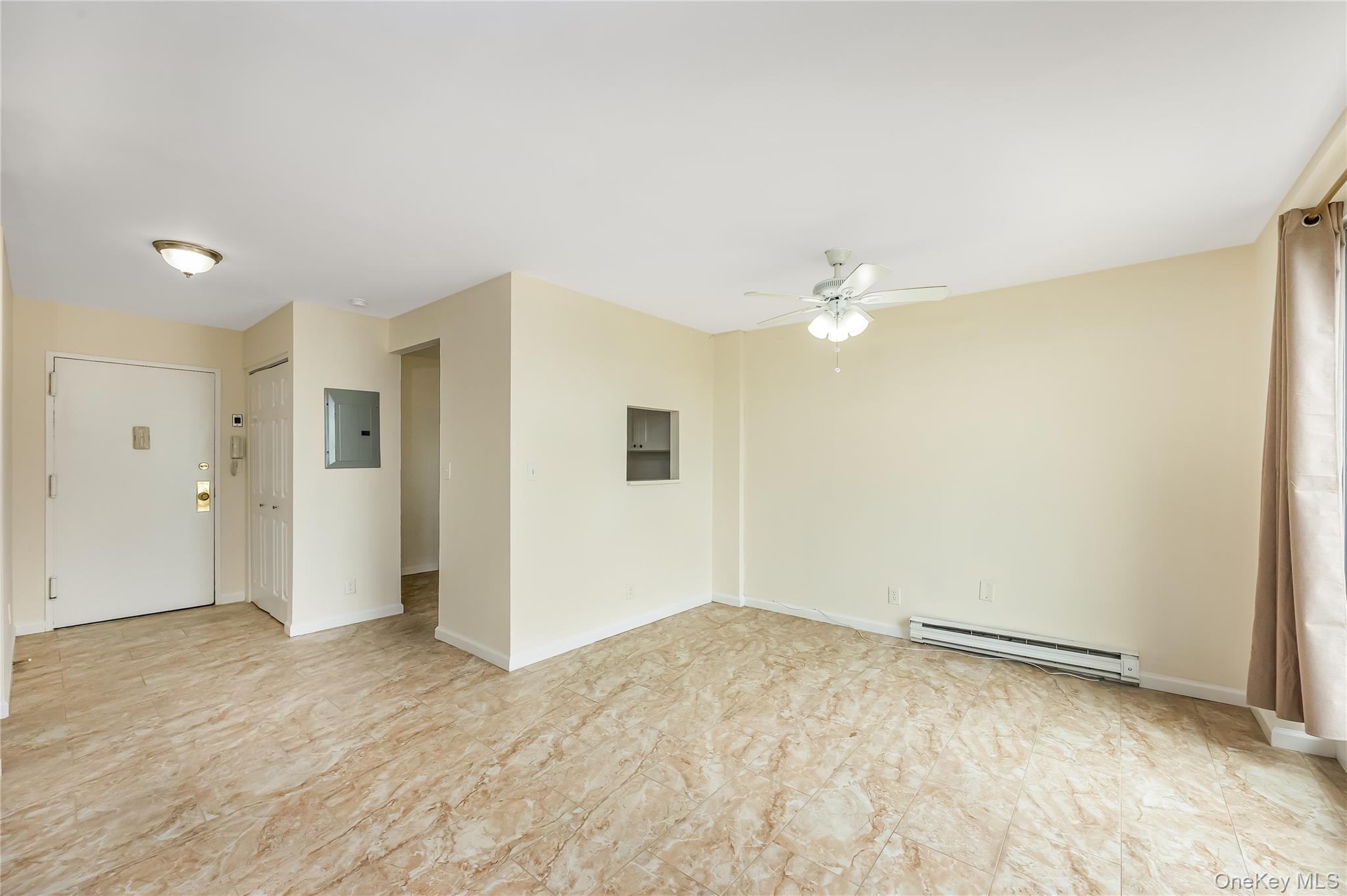 2 Richmond Road, Unit 6M Lido Beach, NY 11561 - Photo 11 of 21 a view of a big room with wooden floor and cabinet