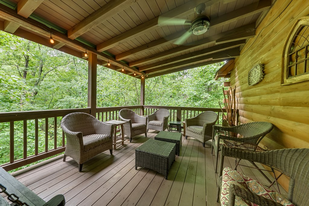 149 Mountain Springs Road Warm Springs, GA 31830 - Photo 40 of 43 a balcony with chairs and wooden floor