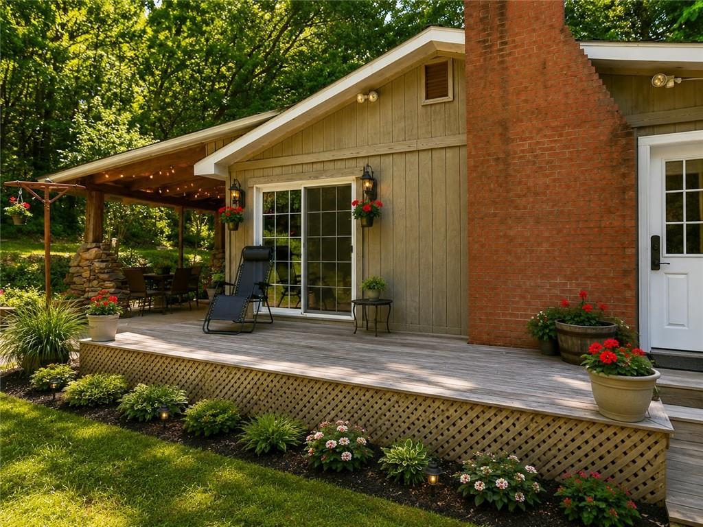 149 Seneca School Road Harmony, PA 16037 - Photo 37 of 50 VIRTUAL IDEA...Cozy countryside deck with lush greenery