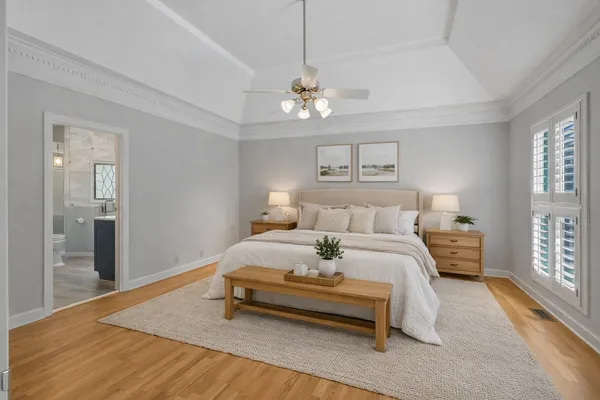 a bed room with a bed and a chandelier