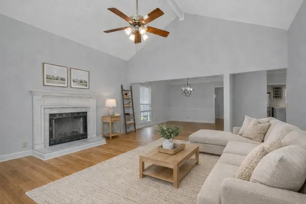 a living room with furniture and a fireplace