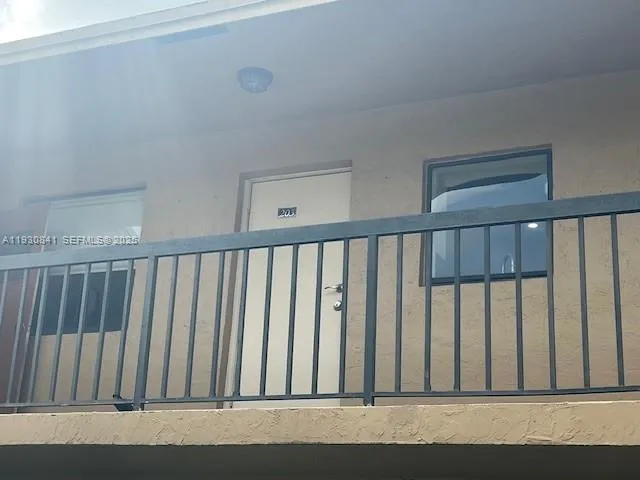 a kitchen with granite countertop white cabinets and stainless steel appliances