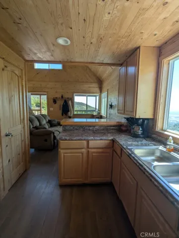 a kitchen with sink and cabinets