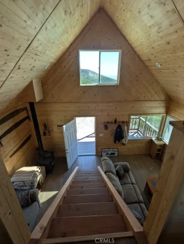 a view of living room with furniture and a rug