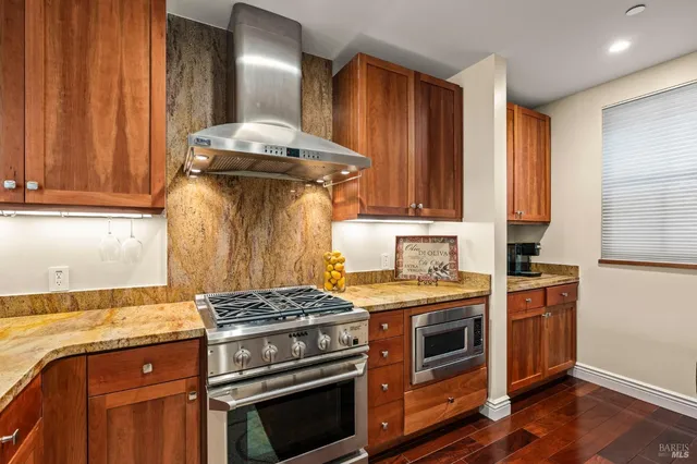 a kitchen with a stove and a sink