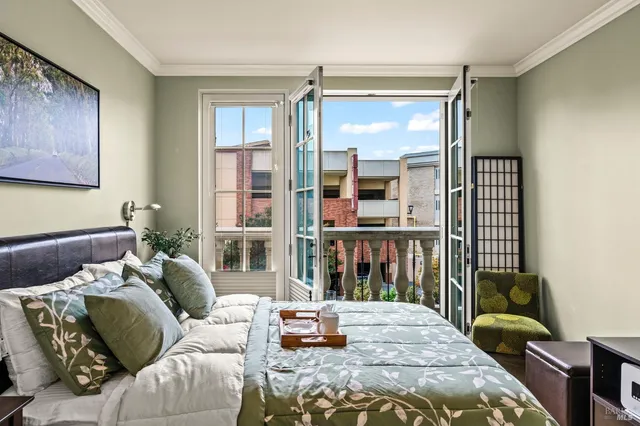 a bedroom with furniture and a window