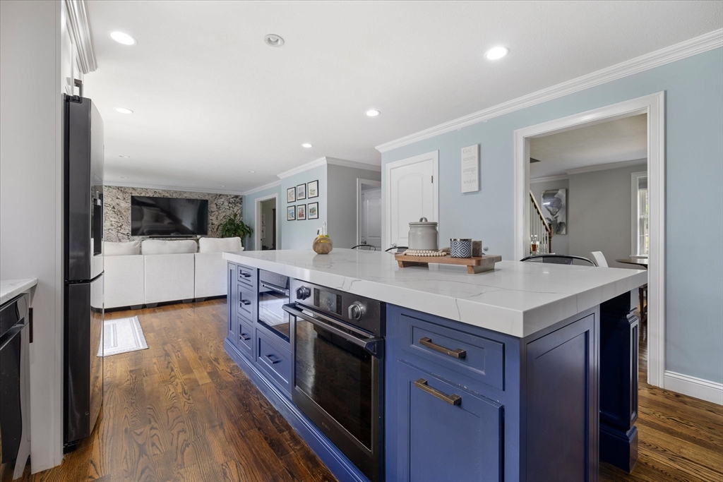 7 Beaman Lane Marlborough, MA 01752 - Photo 12 of 42 a kitchen with stainless steel appliances granite countertop a sink and wooden floor