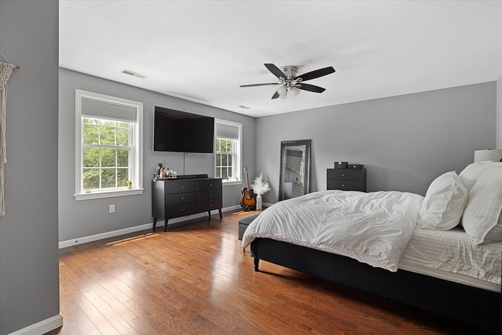 7 Beaman Lane Marlborough, MA 01752 - Photo 19 of 42 a bedroom with a bed and a flat screen tv