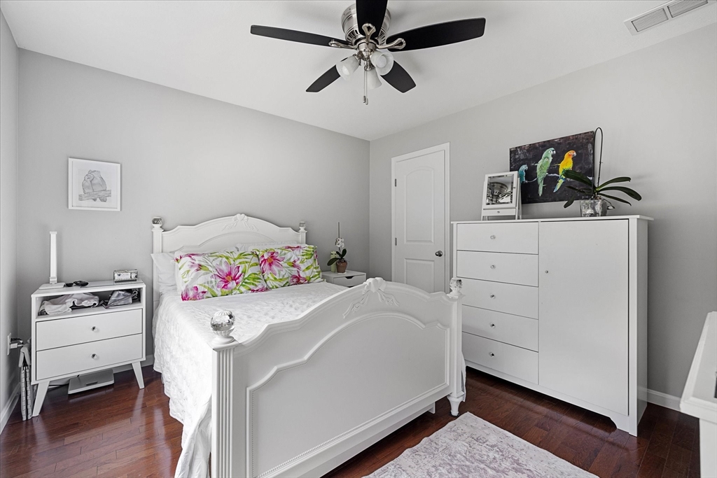 7 Beaman Lane Marlborough, MA 01752 - Photo 20 of 42 a bedroom with a bed and wooden floor