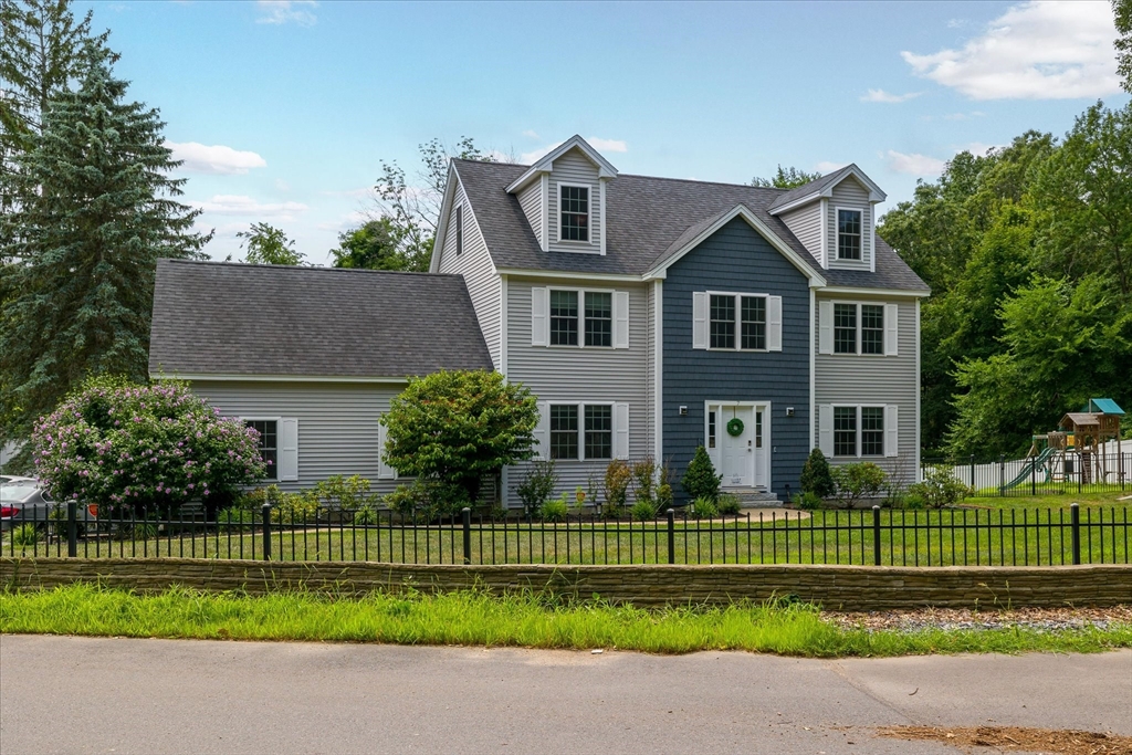 7 Beaman Lane Marlborough, MA 01752 - Photo 2 of 42 a front view of a house with a garden