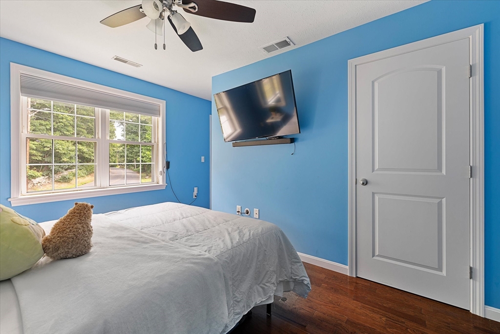 7 Beaman Lane Marlborough, MA 01752 - Photo 24 of 42 a bedroom with a bed and a flat screen tv