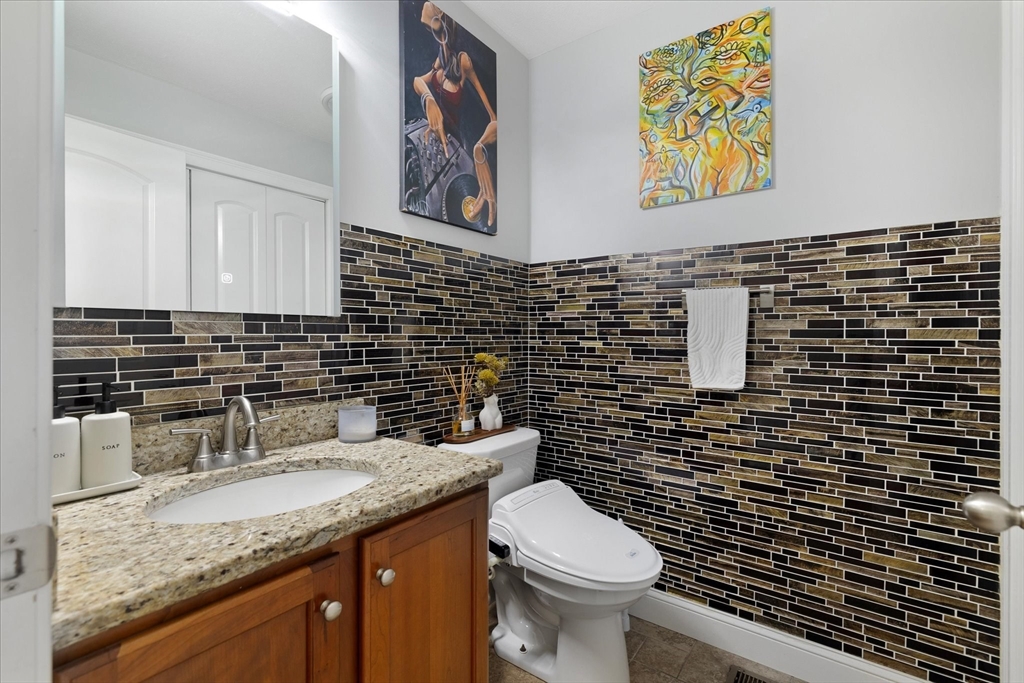 7 Beaman Lane Marlborough, MA 01752 - Photo 25 of 42 a bathroom with a granite countertop toilet sink and mirror