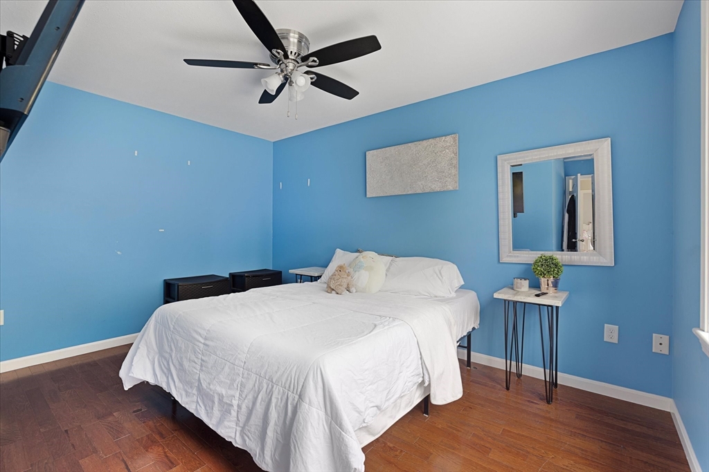 7 Beaman Lane Marlborough, MA 01752 - Photo 26 of 42 a bedroom with a bed and a ceiling fan