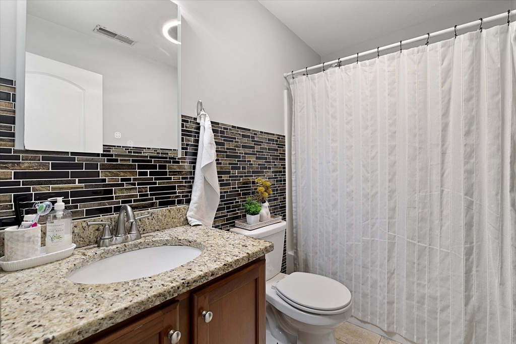 7 Beaman Lane Marlborough, MA 01752 - Photo 28 of 42 a bathroom with a granite countertop sink and a mirror