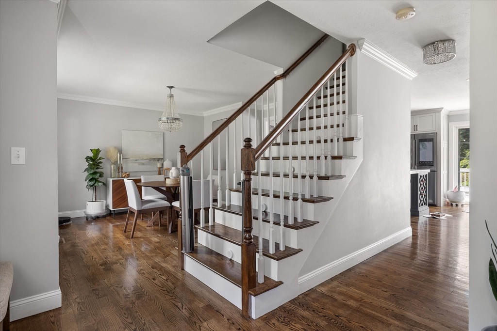 7 Beaman Lane Marlborough, MA 01752 - Photo 3 of 42 a view of entryway with wooden floor and stairs