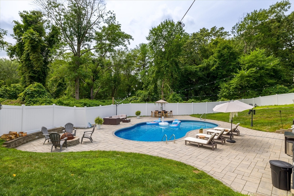 7 Beaman Lane Marlborough, MA 01752 - Photo 35 of 42 a view of a patio with table and chairs under an umbrella
