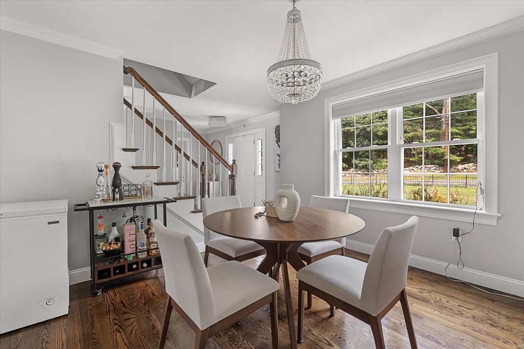 7 Beaman Lane Marlborough, MA 01752 - Photo 6 of 42 a dining room with furniture a chandelier and wooden floor