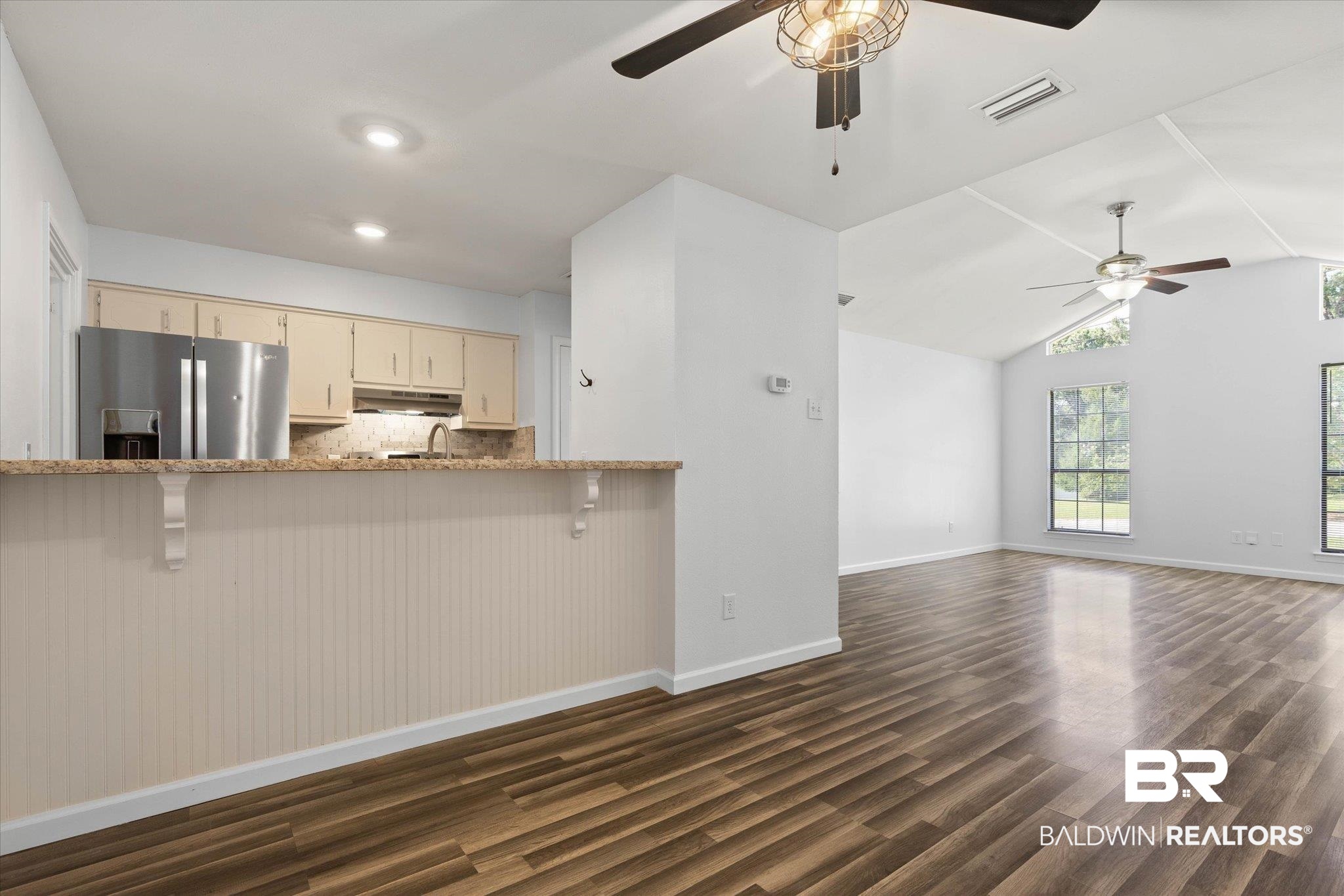 123 Richmond Road Daphne, AL 36526 - Photo 5 of 35 Kitchen with stainless steel fridge, ceiling fan, under cabinet range hood, dark wood-style floors, and cream cabinets
