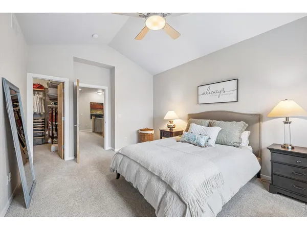 a bedroom with a bed and glass windows