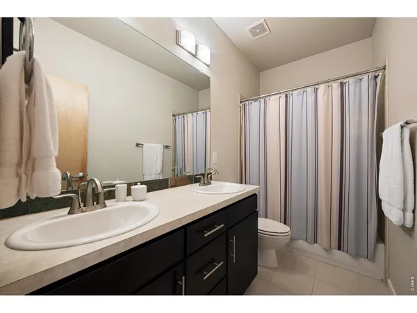 a view of storage and utility room with washer and dryer