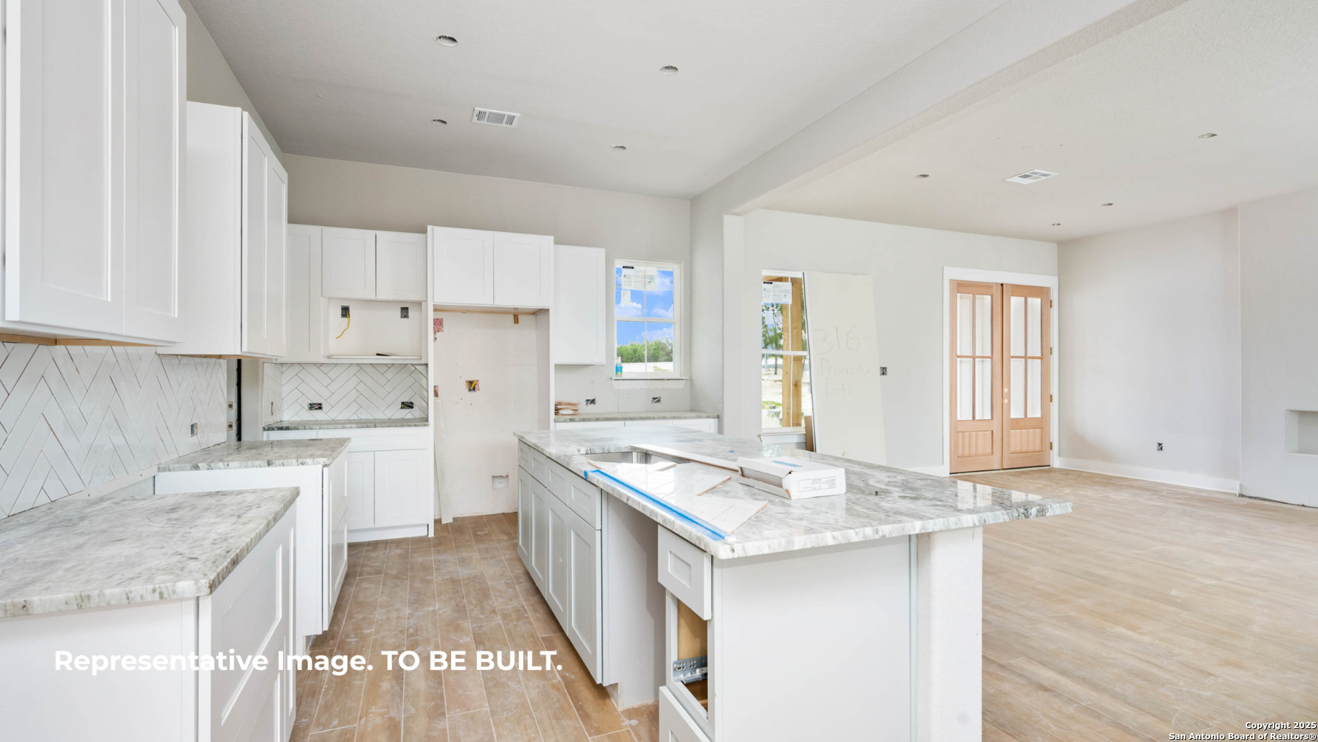 532 Restless Wind Spring Branch, TX 78070 - Photo 4 of 16 a kitchen with granite countertop a sink stove and refrigerator
