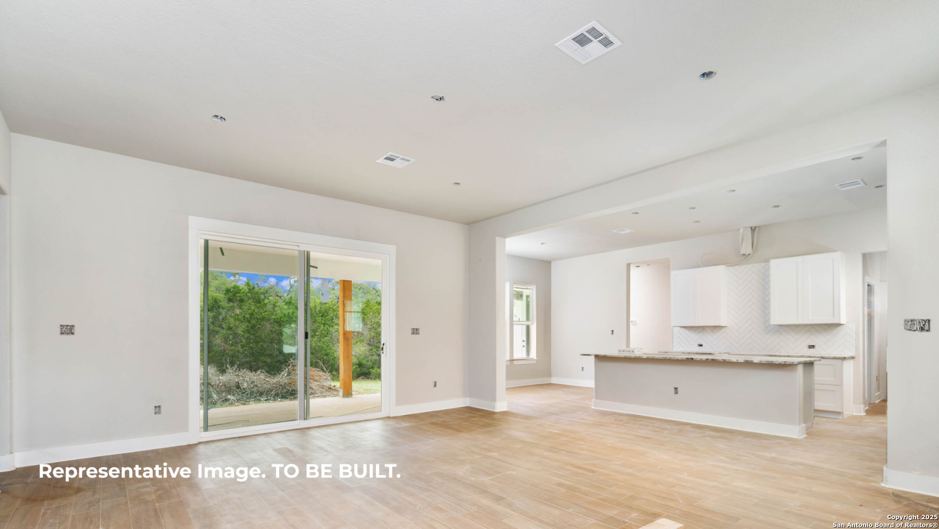 532 Restless Wind Spring Branch, TX 78070 - Photo 6 of 16 a view of an empty room with a kitchen