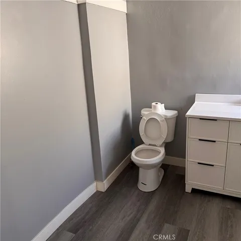 a bathroom with a toilet and a vanity