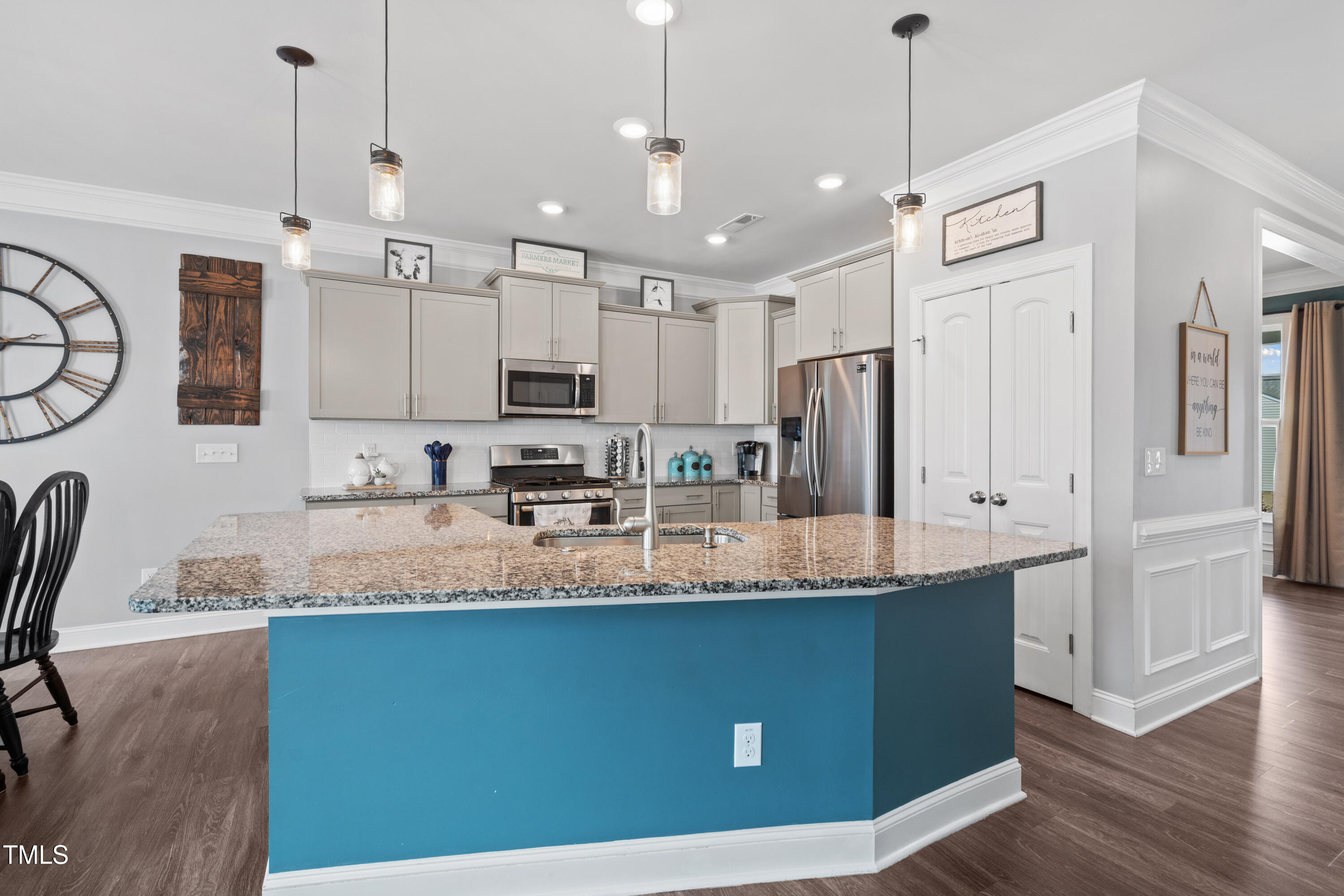 115 Cliffview Drive Garner, NC 27529 - Photo 13 of 52 a kitchen with stainless steel appliances granite countertop a sink refrigerator and cabinets