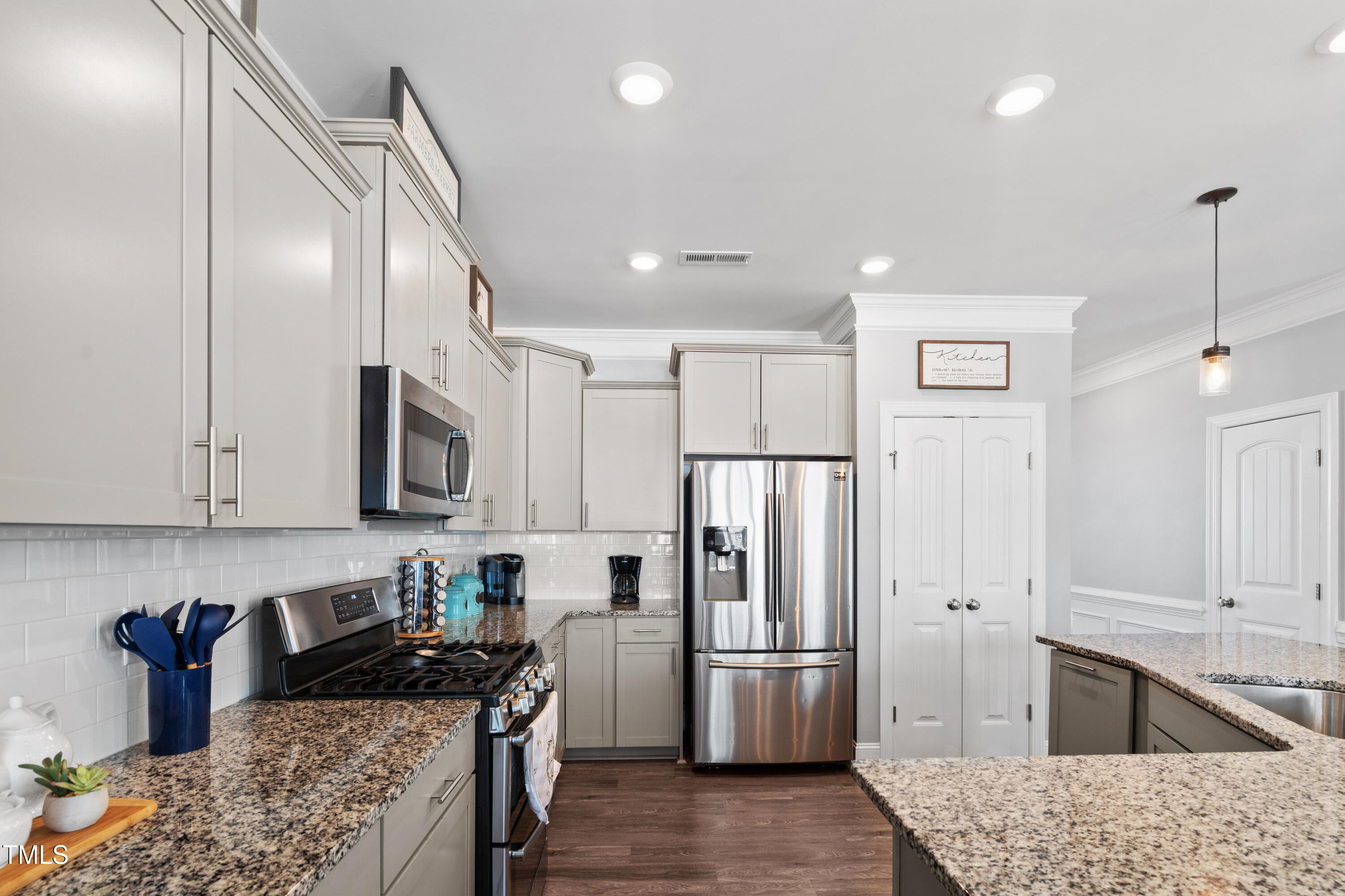 115 Cliffview Drive Garner, NC 27529 - Photo 14 of 52 a kitchen with stainless steel appliances granite countertop a refrigerator stove and microwave