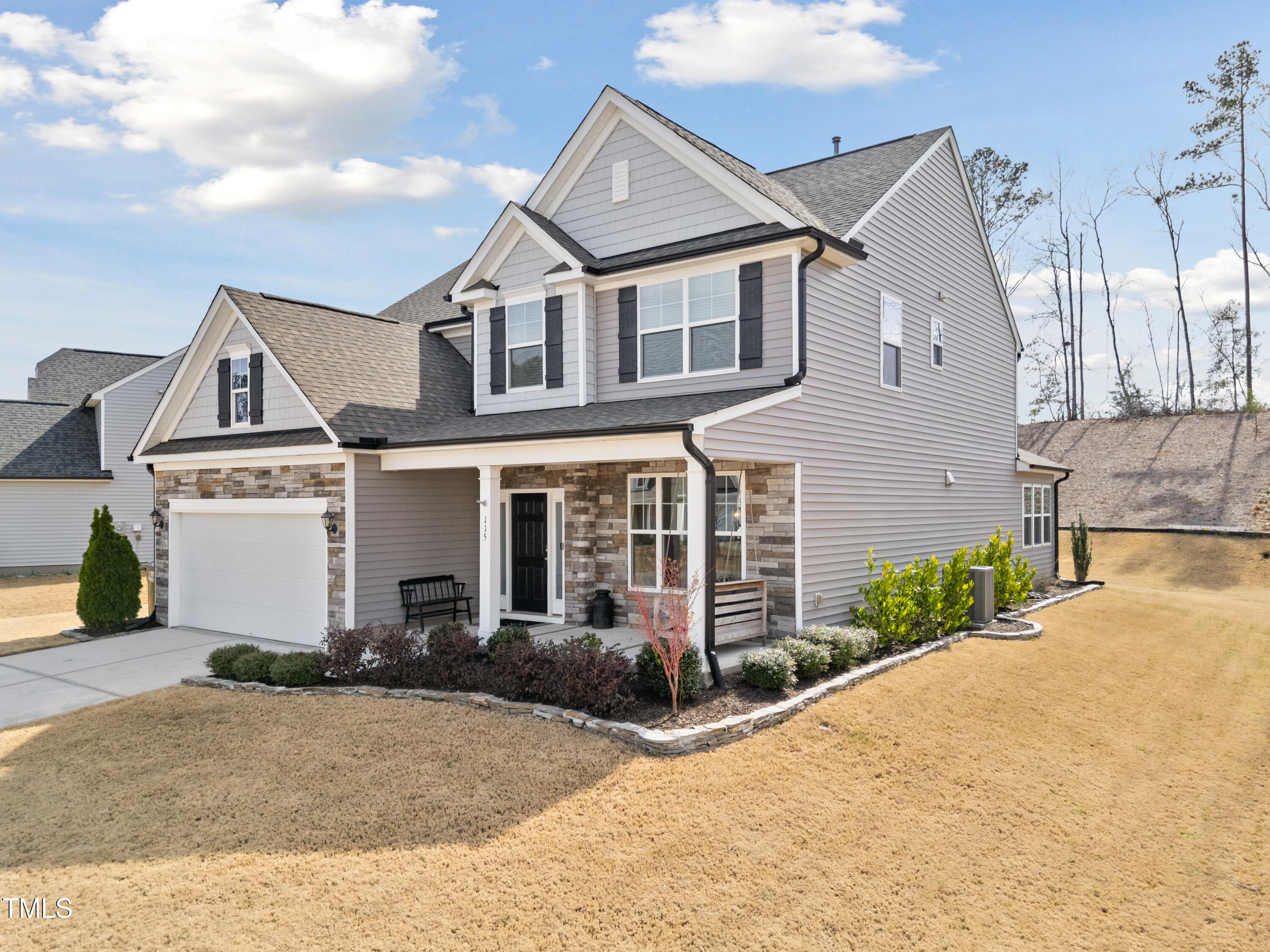 115 Cliffview Drive Garner, NC 27529 - Photo 2 of 52 a front view of a house with a yard and garage