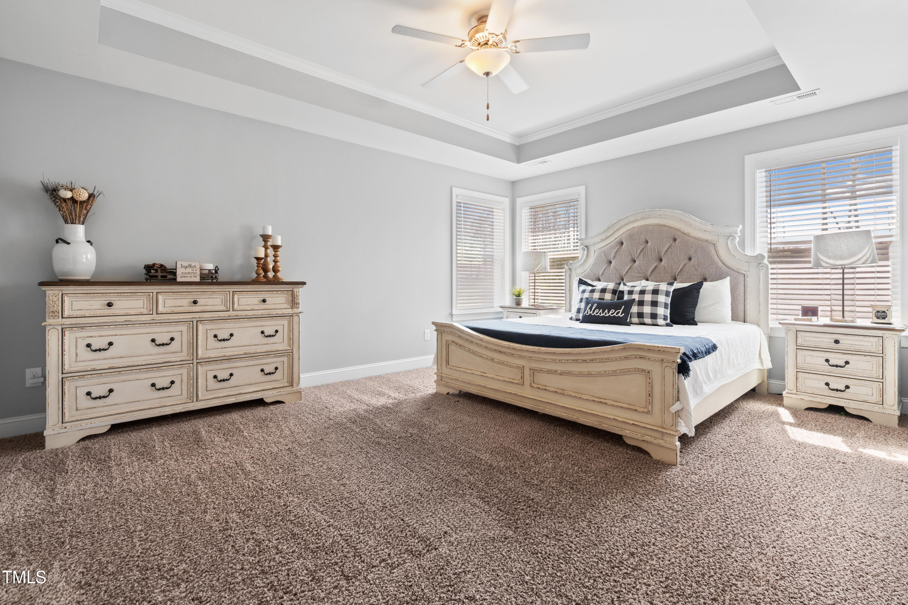 115 Cliffview Drive Garner, NC 27529 - Photo 22 of 52 a bedroom with a bed and a chandelier