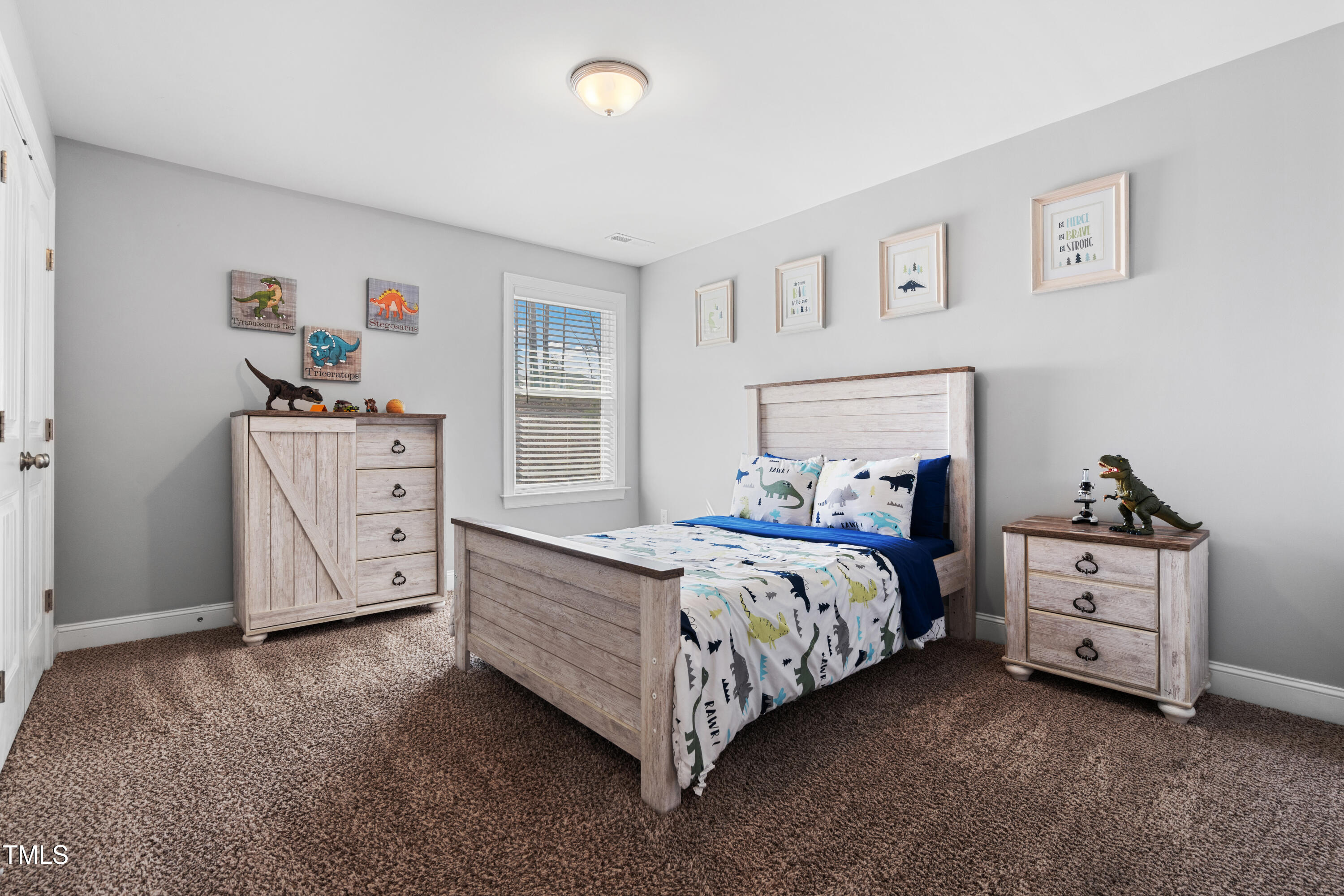 115 Cliffview Drive Garner, NC 27529 - Photo 31 of 52 a bed room with a bed and a window