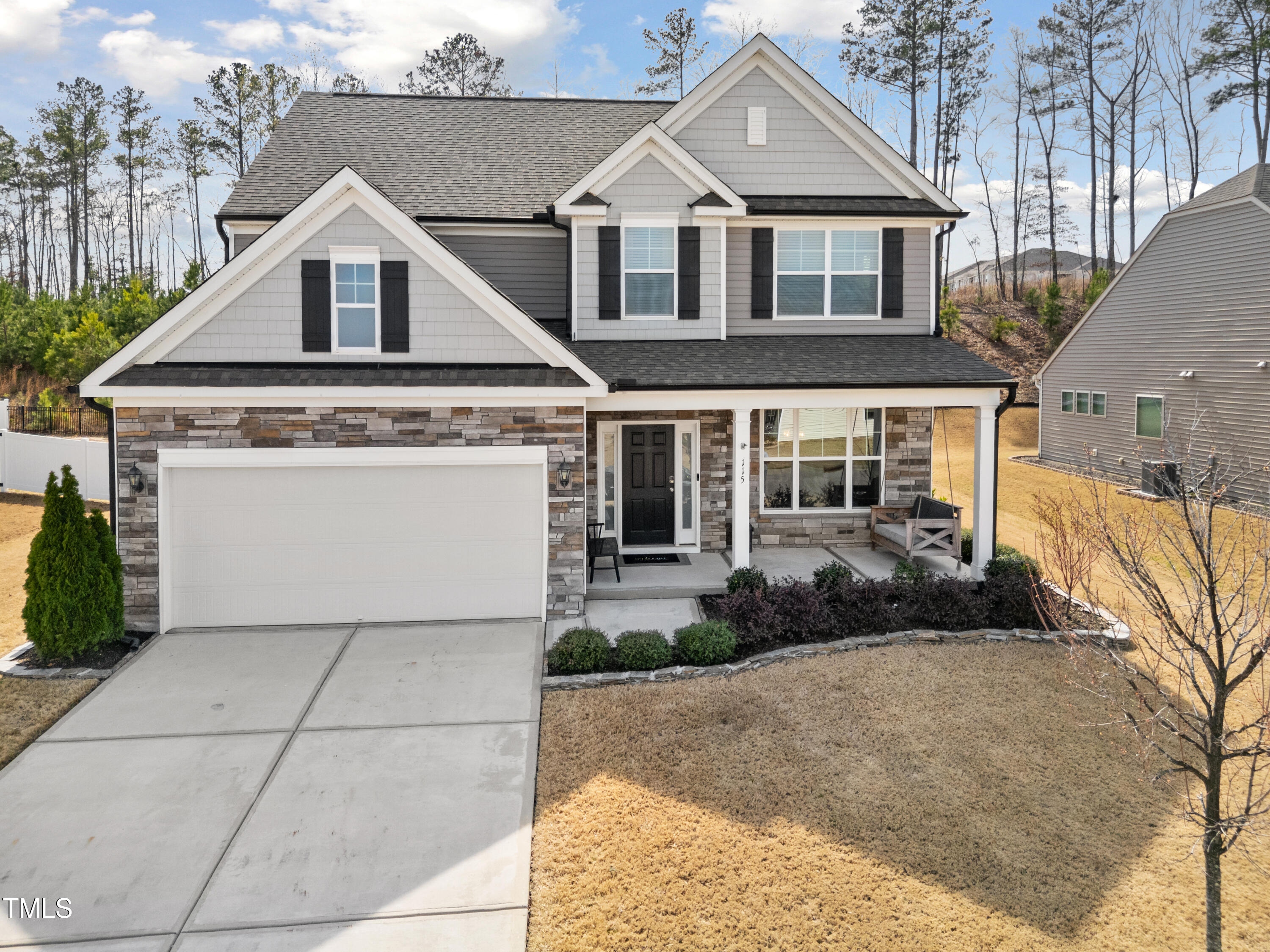 115 Cliffview Drive Garner, NC 27529 - Photo 50 of 52 a front view of a house with a yard and garage