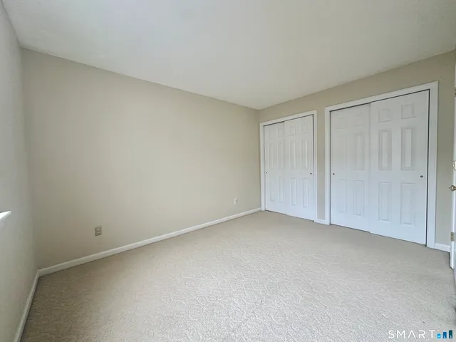 a view of an empty room and entryway