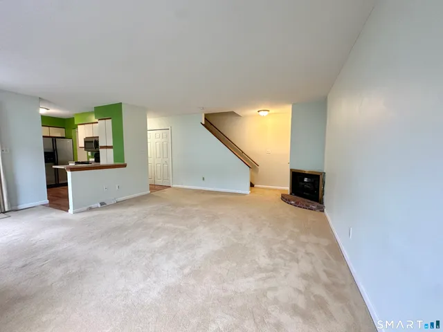 an empty room with a kitchen